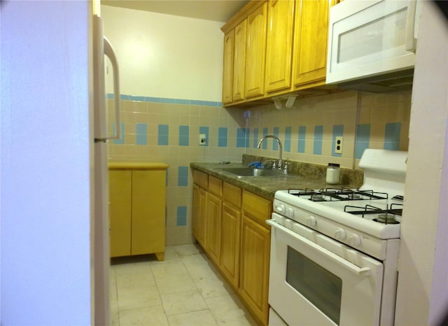 kitchen with sink and white appliances