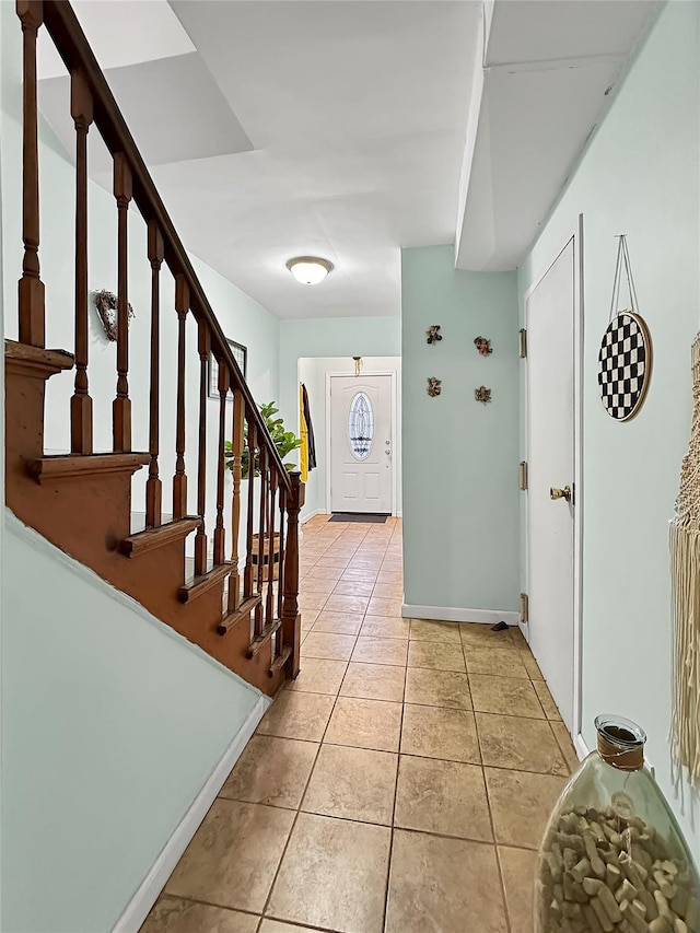 foyer featuring light tile patterned flooring