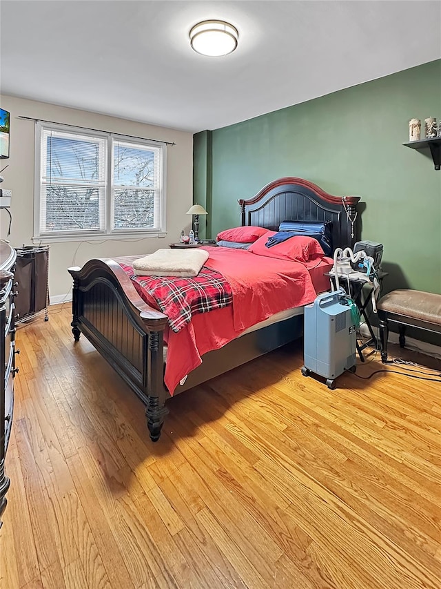 bedroom with light hardwood / wood-style floors