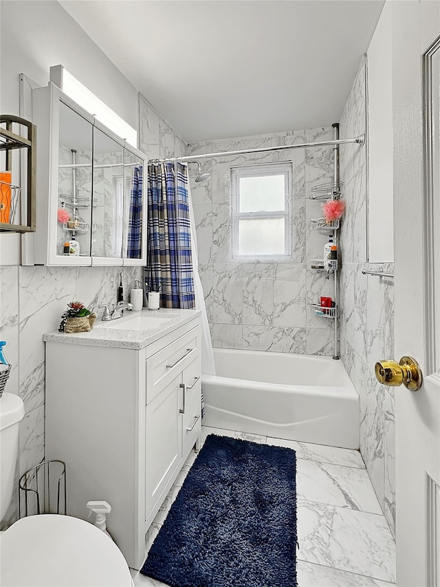 full bathroom with toilet, shower / tub combo, vanity, and tile walls