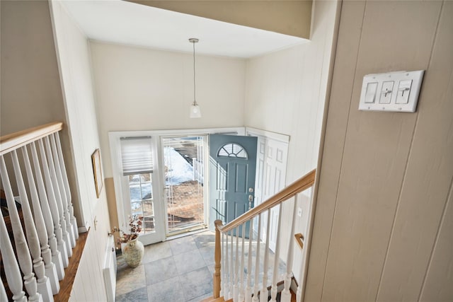 entryway featuring a towering ceiling