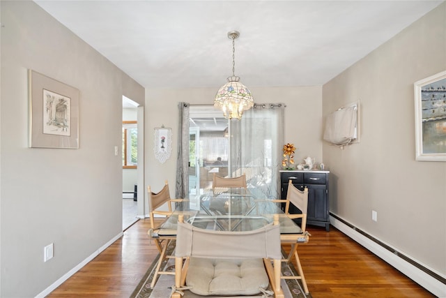 dining space with a baseboard heating unit, an inviting chandelier, and dark hardwood / wood-style floors