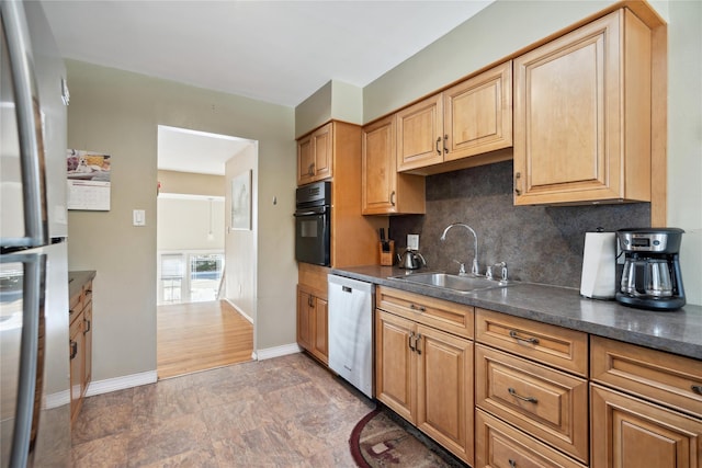 kitchen with stainless steel appliances, tasteful backsplash, and sink