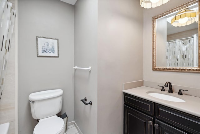 bathroom featuring walk in shower, vanity, and toilet