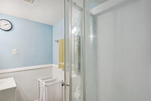 bathroom featuring vanity and walk in shower