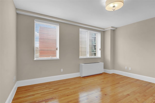 unfurnished room featuring hardwood / wood-style floors