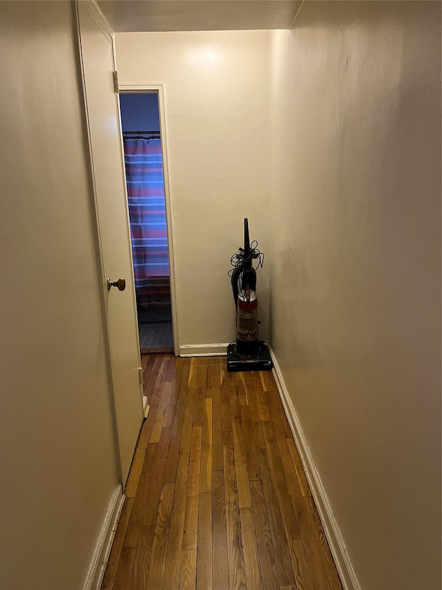 hall with dark hardwood / wood-style flooring