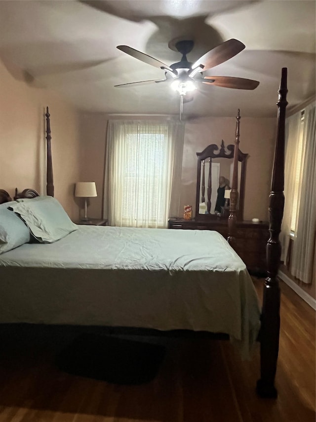 bedroom with ceiling fan and hardwood / wood-style floors