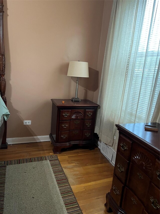 bedroom with light wood-type flooring