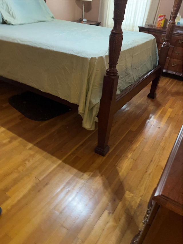 bedroom featuring wood-type flooring