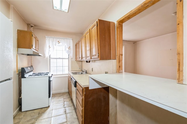 kitchen featuring sink and white appliances