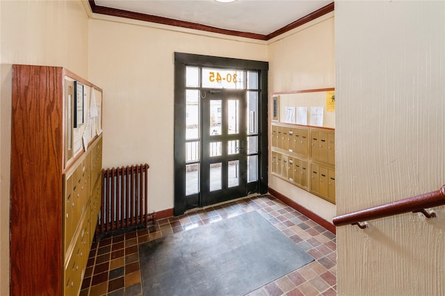 entryway featuring mail boxes, crown molding, and radiator heating unit