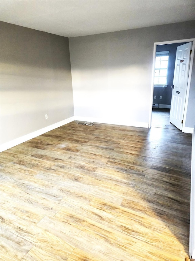 unfurnished room featuring hardwood / wood-style floors