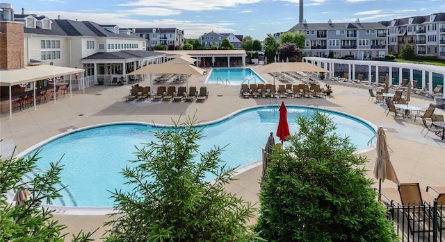 319 Trotting Ln Unit 23, Westbury, NY 11590 - community pool featuring a patio and a residential view