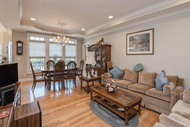319 Trotting Ln Unit 23, Westbury, NY 11590 - living room featuring a chandelier, ornamental molding, light wood finished floors, a raised ceiling, and recessed lighting