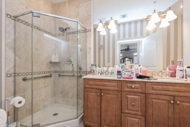 319 Trotting Ln Unit 23, Westbury, NY 11590 - full bath featuring double vanity, a shower stall, and wallpapered walls