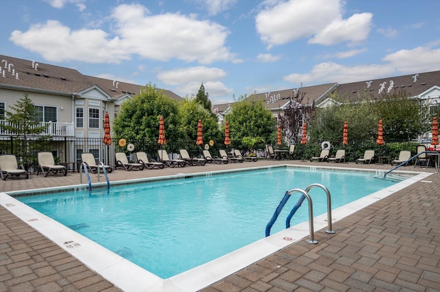 view of swimming pool featuring a patio area