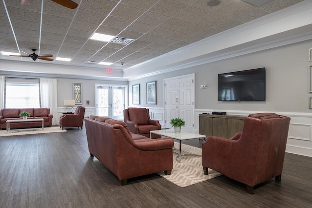 living room featuring ceiling fan, french doors, dark hardwood / wood-style floors, and ornamental molding