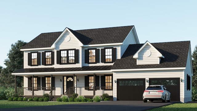 view of front of home featuring driveway, a standing seam roof, a garage, and a porch