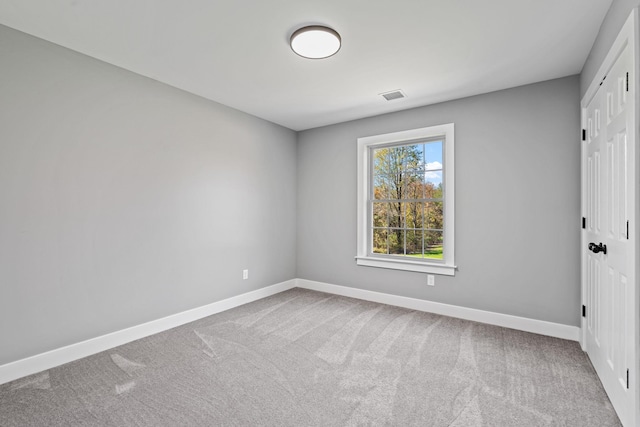 unfurnished bedroom with baseboards, visible vents, a closet, and carpet flooring