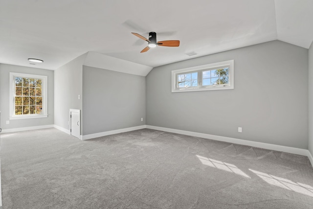 bonus room featuring vaulted ceiling, carpet floors, and baseboards