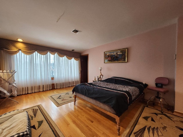 bedroom with wood-type flooring