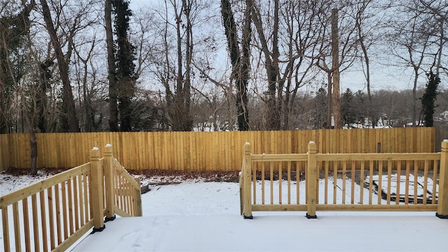 view of yard layered in snow