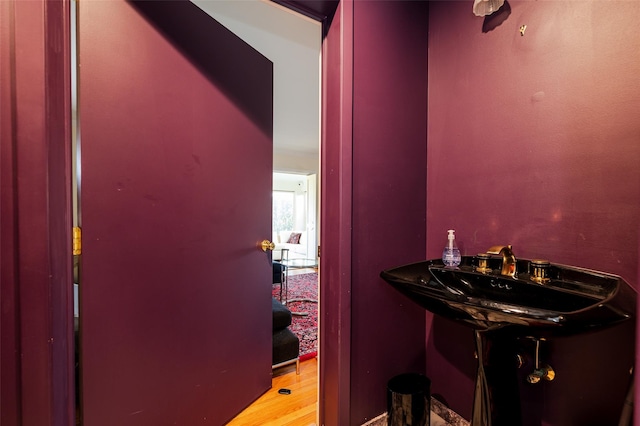 bathroom featuring sink and hardwood / wood-style floors