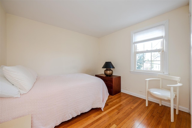 bedroom with light hardwood / wood-style floors