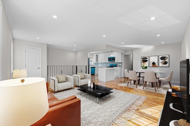 living room with light hardwood / wood-style flooring