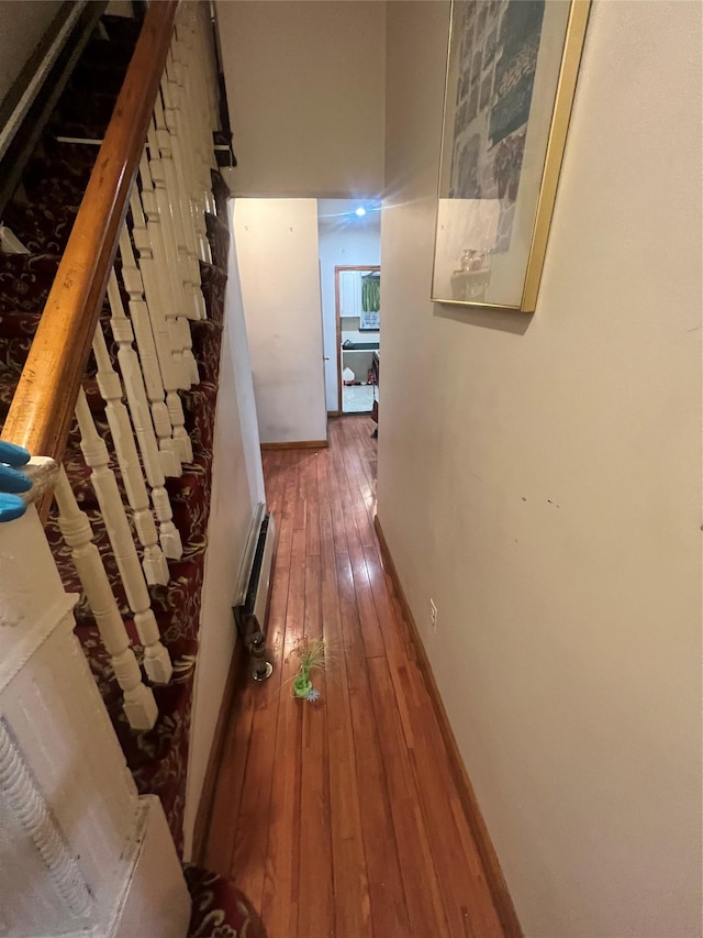 hallway with dark hardwood / wood-style floors