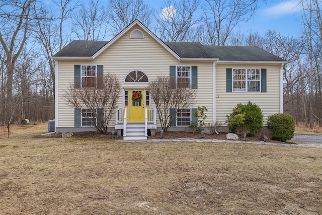 raised ranch with a front yard