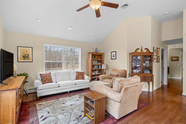 living room featuring ceiling fan, a baseboard heating unit, dark hardwood / wood-style floors, and vaulted ceiling