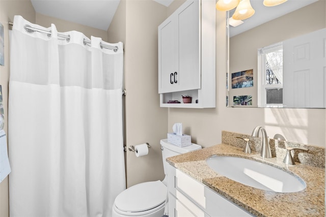 bathroom with toilet and vanity