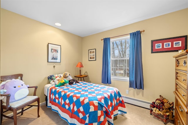 carpeted bedroom with a baseboard radiator