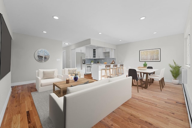 living room with light hardwood / wood-style flooring