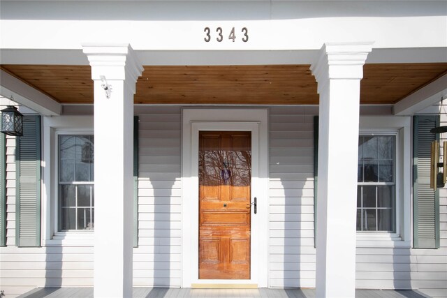 doorway to property featuring a porch