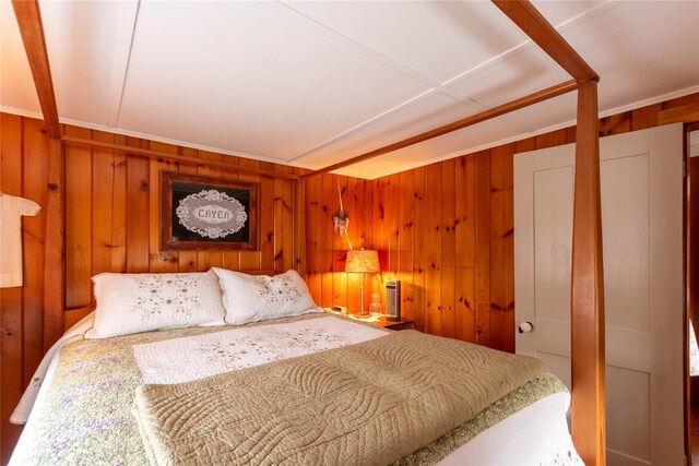 bedroom with wooden walls