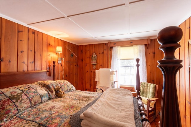 bedroom with wood walls