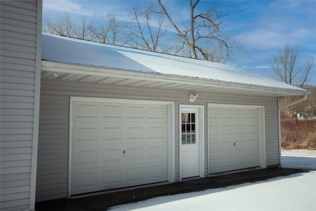 view of snow covered garage