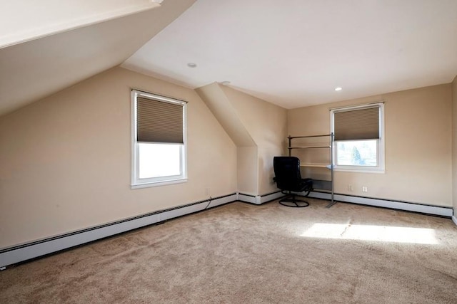 bonus room with lofted ceiling and light colored carpet