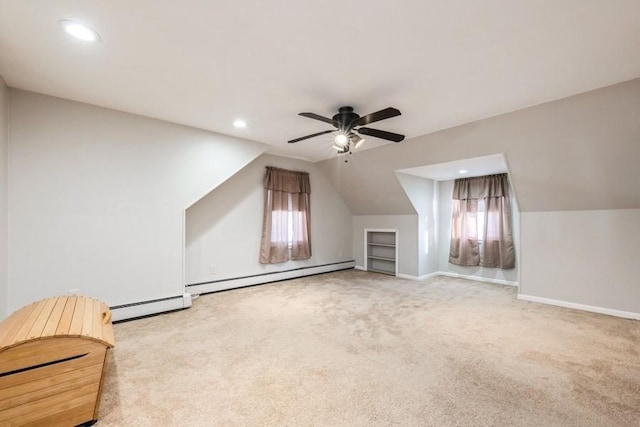 additional living space with a baseboard heating unit, ceiling fan, lofted ceiling, and light carpet