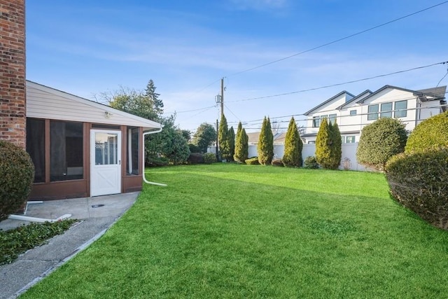 view of yard with a sunroom