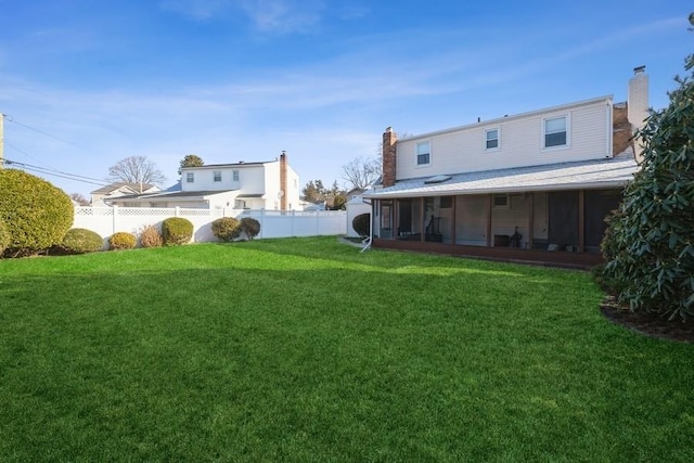 view of yard featuring a sunroom