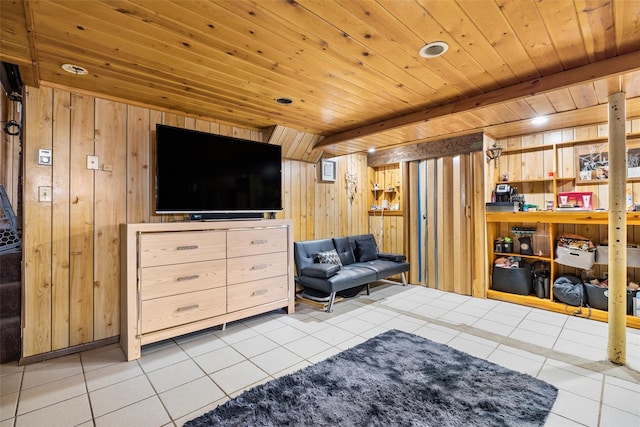 living room with wooden ceiling, light tile patterned floors, and wood walls