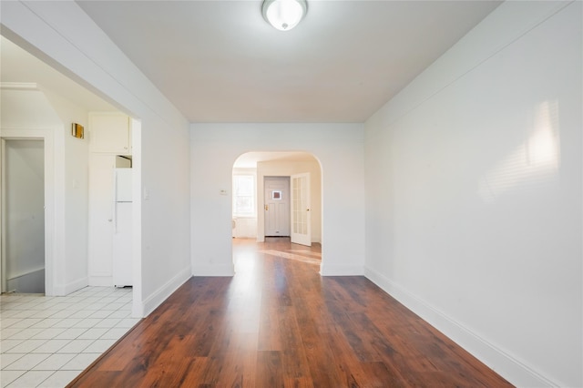 spare room featuring wood-type flooring