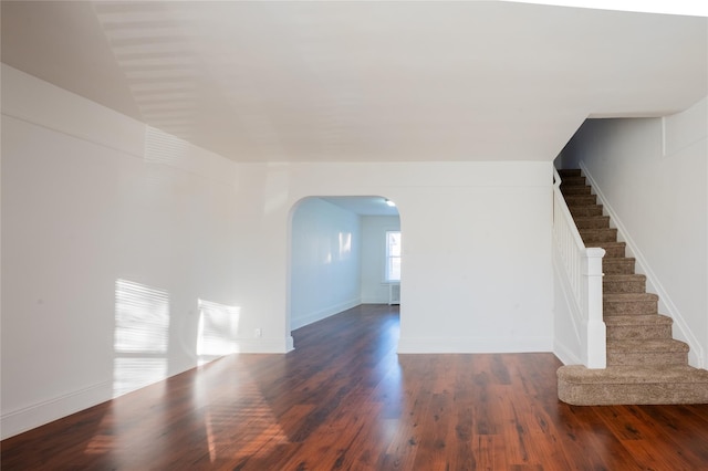 spare room featuring dark wood-type flooring