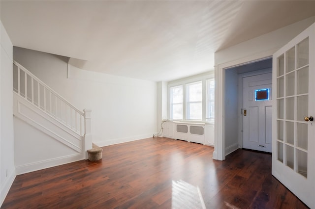 interior space featuring dark hardwood / wood-style floors and radiator