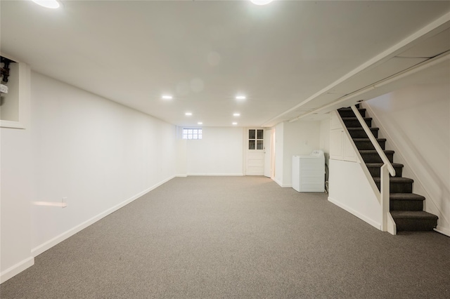 basement featuring carpet and washer / dryer