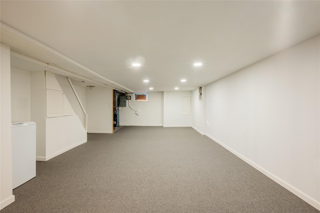 basement with carpet and washer / clothes dryer